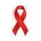 Red AIDS ribbon isolated on white background.