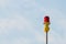 Red aircraft warning lights with blue sky background