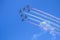 Red aircrafts aerobatic group drawing Spanish flag figure in the
