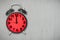 Red Alarm clock lunch time on gray cement background