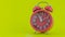 Red alarm clock on yellow background Before Twelve o`Clock on New Years Eve of Face of Beautiful alarm clock Indicating midnight
