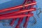Red aluminum tent pegs. Camping equipment. Protecting tent roofs from wind and rain