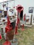 Red antique objects display outdoors in rural Nebraska.