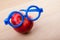 Red Apple blue glasses wooden table