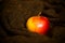 Red apple on brown cloth