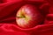 Red apple in cloth