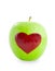 Red apple heart shape in Green apple.