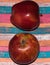 Red apple isolated on original colorful background