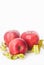 Red Apple with Measure Tape for Loose Weigh, diet and fitness with copy space . Isoalted on White Background. Vertical image.