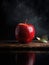 Red apple sits on top of dark background