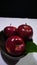 Red apple with stem leaf on bowl. Image fruit