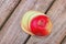 Red apple in wooden background