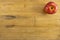 Red Apple on Worn Cutting Board