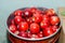 Red apples in aluminum round tray