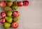 Red apples and green pears on a linen napkin.