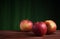 Red apples on a grunge wood and orange background