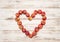 Red apples heart over wooden background. Love concept