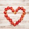 Red apples heart over wooden background. Love concept vibrant