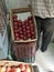 Red apples kept in basket to sell in a fruit shop with quality approved stickers