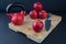 Red apples, knife, and kettlebell on chopping board