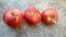 Red apples, ripe on  a concrete background