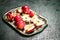 Red apples on a steel tray with leaves.