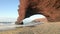 Red archs on atlantic ocean coast near Legzira, Morocco