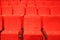 red armchairs. Empty concert hall, theater chairs background ... color photo, empty cinema or concert hall. The red