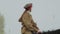 Red Army young girl soldier in soviet uniform riding on horse to battle against German army during reconstruction of