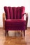 Red art deco retro chair in empty room