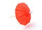 Red asian cocktail umbrella on white