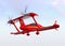 Red autonomous flying drone taxi in the sky