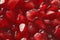 Red Background of Grain Red Grenades. Big Ripe Red Granets or Garnets. Fruits of Red Ripe Pomegranate on the White Background.