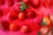 Red background with radial blur of whole strawberries on red cutting board