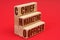 On a red background, wooden blocks with the inscription - Chief Marketing Officer