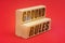 On a red background, wooden blocks with the inscription - GROUND RULES