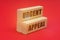 On a red background, wooden blocks with the inscription - URGENT APPEAL