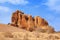 Red bald granite peaks on blue sky background, ancient geological formations, orange stones, natural yellow rocks Erongo mountains