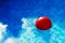 Red ball in swimming pool