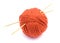 Red ball of wool and knitting needles