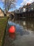 Red balloon floating on the Old Canal of Utrecht