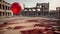 Red balloon floating among ruins of city, desolated and torn apart by war.