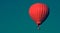 Red balloon in the sky.