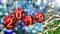 Red balls with numbers 2019 hanging on the background of a blue bokeh and a rotating Christmas tree 3d rendering.