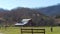 Red barn beautiful green pasture mountains behind