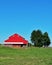 Red barn, blue sky.