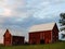 Red barn buildings in western evening sun in Finger Lakes