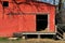 Red barn door hanging doors metal corrugated entrance horse cow cattle shelter feed store warehouse farming building