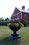 Red Barn Front with Plant Arrangement