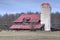 Red barn in the harvested fields.